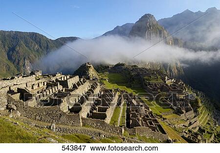 Clouds over old ruins on mountain, Inca Ruins, Machu Picchu, Cusco Region, Peru View Large Photo Image Stock Photo - Clouds over old ruins on mountain, Inca Ruins, Machu Picchu, Cusco Region, Peru . Fotosearch