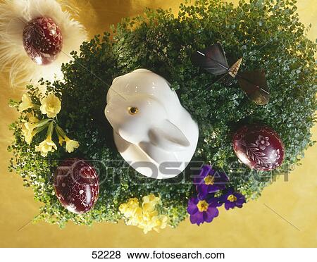 Easter eggs with easter bunny in nest View Large Photo Image Stock Photo - Easter eggs with easter bunny in nest . Fotosearch