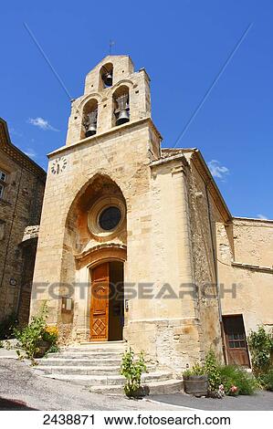 Stock Image - Facade of church, Rousset-Les-Vignes, Vaucluse, Provence-Alpes-Cote d'Azur, France . Fotosearch
