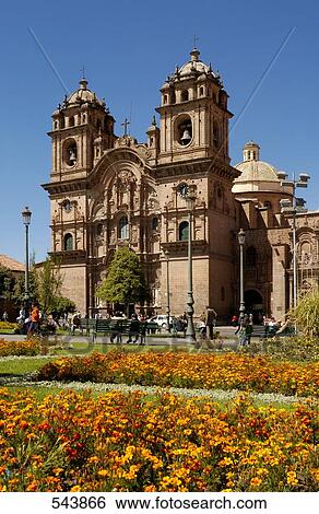 Stock Photograph - Formal garden in front of church, Iglesia La Compania De Jesus, Plaza-De-Armas, Cuzco, Cusco Region, Peru . Fotosearch
