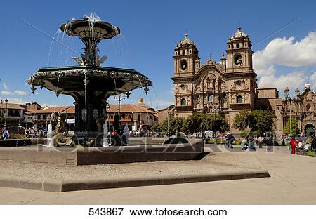 Stock Photo - Fountain in front of church, Iglesia La Compania De Jesus, Plaza-De-Armas, Cuzco, Cusco Region, Peru . Fotosearch