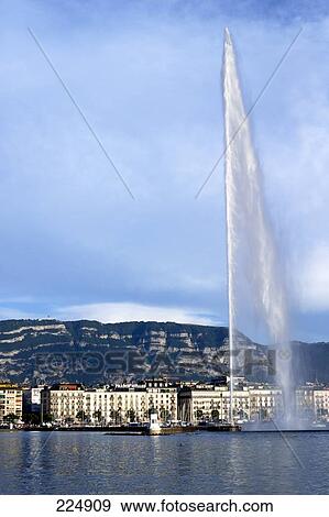 Fountain in lake at waterfront spraying water, Geneve, Switzerland View Large Photo Image Stock Photo - Fountain in lake at waterfront spraying water, Geneve, Switzerland . Fotosearch