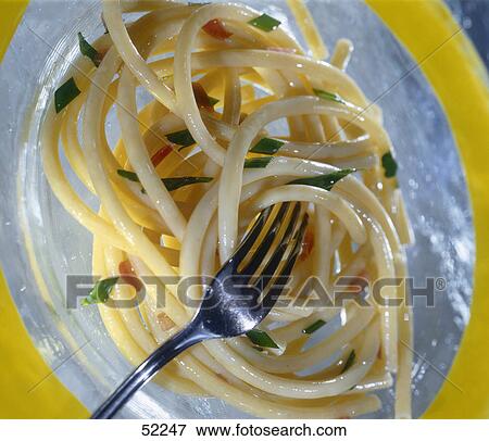 Stock Photo - High angle view of a fork in spaghetti . Fotosearch