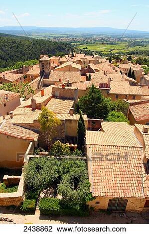 Stock Image - High angle view of houses in town, Le Barroux, Vaucluse, Provence-Alpes-Cote d'Azur, France . Fotosearch