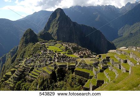 Stock Photo - High angle view of old ruins on mountain, Inca Ruins, Machu Picchu, Cusco Region, Peru . Fotosearch