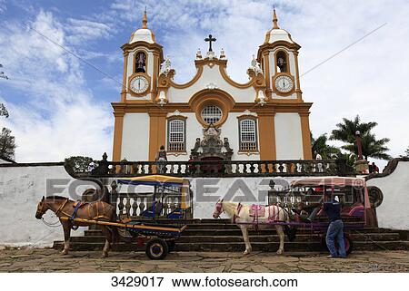 Horsedrawn carriages in front of Santo Antonio Church, Tiradentes, Minas Gerais, Brazil View Large Photo Image Stock Photo - Horsedrawn carriages in front of Santo Antonio Church, Tiradentes, Minas Gerais, Brazil . Fotosearch