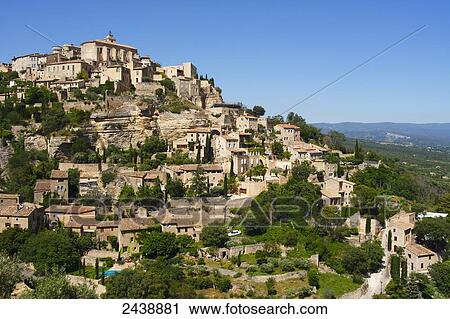 Stock Image - Houses on hill, Vaucluse, Provence-Alpes-Cote d'Azur, France . Fotosearch