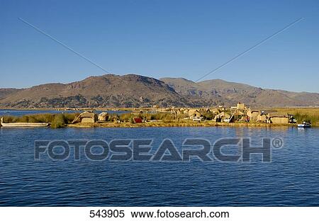 Huts on floating island, Uros Floating Island, Lake Titicaca, Peru View Large Photo Image Stock Photography - Huts on floating island, Uros Floating Island, Lake Titicaca, Peru . Fotosearch