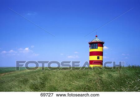 Lighthouse on grassy field, Pilsum, East Frisia, Lower Saxony, Germany View Large Photo Image Stock Photo - Lighthouse on grassy field, Pilsum, East Frisia, Lower Saxony, Germany . Fotosearch