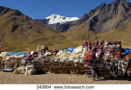 Man at market stalls selling souvenirs, Peru View Large Photo Image Picture - Man at market stalls selling souvenirs, Peru . Fotosearch