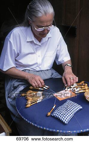 Stock Photograph - Mature woman doing handicraft work, Bruges, West Flanders, Belgium . Fotosearch