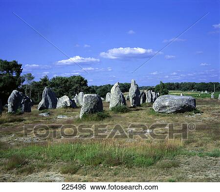 Stock Photograph - Megalithic rocks on landscape, Carnac, Brittany, France . Fotosearch