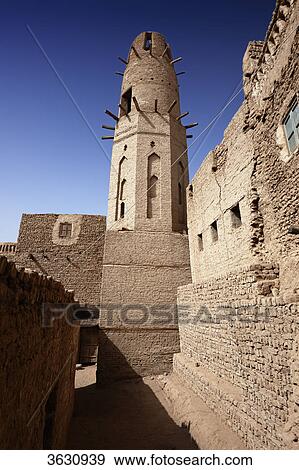 Minaret of mosque in the old town Al-Qasr, Dakhla Oasis, Libyan Desert, Egypt View Large Photo Image Stock Photo - Minaret of mosque in the old town Al-Qasr, Dakhla Oasis, Libyan Desert, Egypt . Fotosearch