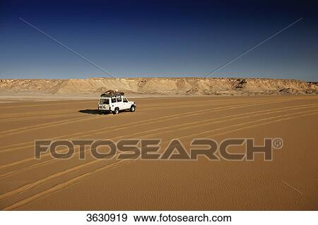 Off-road vehicle in the Libyan Desert, Egypt View Large Photo Image Stock Photo - Off-road vehicle in the Libyan Desert, Egypt . Fotosearch