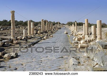 Stock Image - Old ruins of columns, Umm Qais, Jordan . Fotosearch