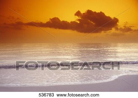Stock Image - Panoramic view of sunset at sea . Fotosearch