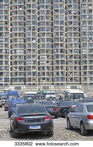 Stock Image - Parking place in front of an apartment block, Shanghai, China . Fotosearch
