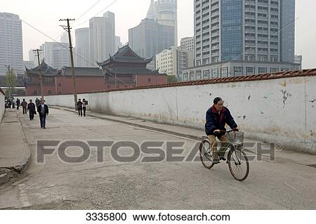 Pedestrians on a street in a working class area, Shanghai, China View Large Photo Image Stock Image - Pedestrians on a street in a working class area, Shanghai, China . Fotosearch