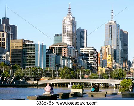 Pedestrians sitting at riverside, Melbourne, Australia View Large Photo Image Stock Photography - Pedestrians sitting at riverside, Melbourne, Australia . Fotosearch