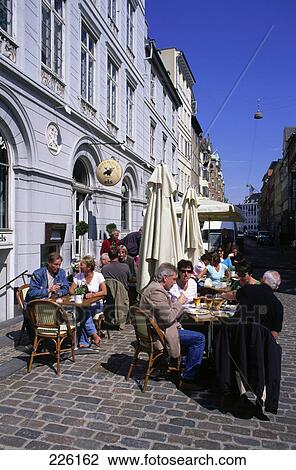 People at sidewalk cafe, Nyhavn, Copenhagen, Sjaelland, Denmark View Large Photo Image Stock Image - People at sidewalk cafe, Nyhavn, Copenhagen, Sjaelland, Denmark . Fotosearch