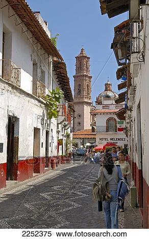 People in street with church in background, San Sebastian y Santa Prisca, Taxco de Alarcon, Guerrero, Mexico View Large Photo Image Stock Photography - People in street with church in background, San Sebastian y Santa Prisca, Taxco de Alarcon, Guerrero, Mexico . Fotosearch
