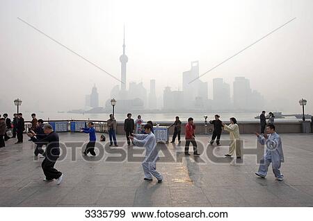 People practicing taiji, The Bund, Shanghai, China View Large Photo Image Stock Photo - People practicing taiji, The Bund, Shanghai, China . Fotosearch