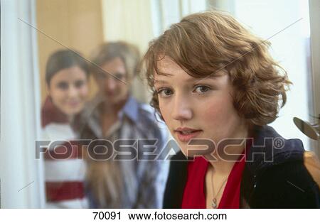 Portrait of teenage girl with her two friends in background View Large Photo Image Stock Image - Portrait of teenage girl with her two friends in background . Fotosearch