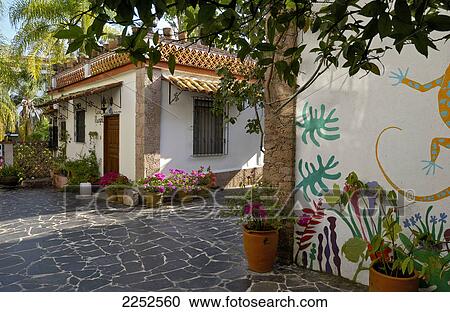 Stock Image - Potted plants in front of house, Taxco, Mexico City, Mexico . Fotosearch