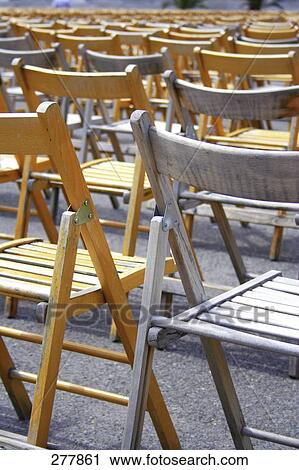 Rear view of empty chairs in rows View Large Photo Image Stock Image - Rear view of empty chairs in rows . Fotosearch
