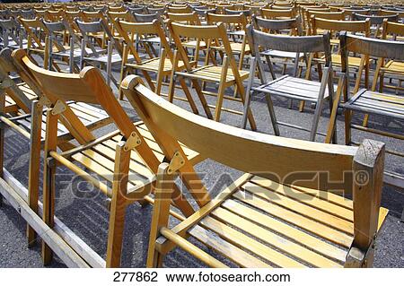 Rear view of empty chairs in rows View Large Photo Image Stock Image - Rear view of empty chairs in rows . Fotosearch