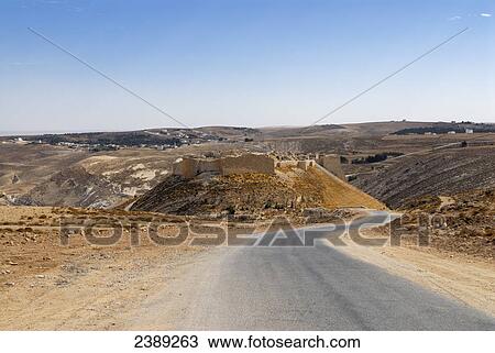 Stock Image - Road running through landscape, Jordan . Fotosearch