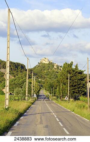 Road running through landscape, Entrechaux, Vaucluse, Provence-Alpes-Cote d'Azur, France View Large Photo Image Stock Image - Road running through landscape, Entrechaux, Vaucluse, Provence-Alpes-Cote d'Azur, France . Fotosearch