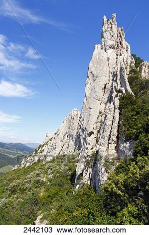 Rock formations on landscape, Dentelles de Montmirail, Vaucluse, Provence-Alpes-Cote d'Azur, France View Large Photo Image Stock Image - Rock formations on landscape, Dentelles de Montmirail, Vaucluse, Provence-Alpes-Cote d'Azur, France . Fotosearch