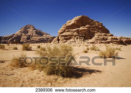 Rock formations on landscape, Wadi Rum, Jordan View Large Photo Image Stock Photograph - Rock formations on landscape, Wadi Rum, Jordan . Fotosearch
