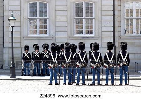 Stock Photograph - Royal guards in front of palace, Amalienborg Palace, Copenhagen, Denmark . Fotosearch