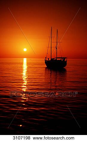 Sailing boat in front of sunset, Hurghada, Egypt, Red Sea, silhouette View Large Photo Image Stock Photo - Sailing boat in front of sunset, Hurghada, Egypt, Red Sea, silhouette . Fotosearch