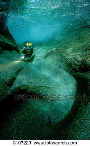 Stock Photo - Scuba diver in the Verzasca river, Tessin, Switzerland, underwater shot . Fotosearch