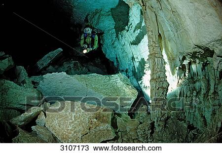 Scuba diver in underwater cave Cueva Taina, Punta Cana, Dominican Republic View Large Photo Image Stock Image - Scuba diver in underwater cave Cueva Taina, Punta Cana, Dominican Republic . Fotosearch