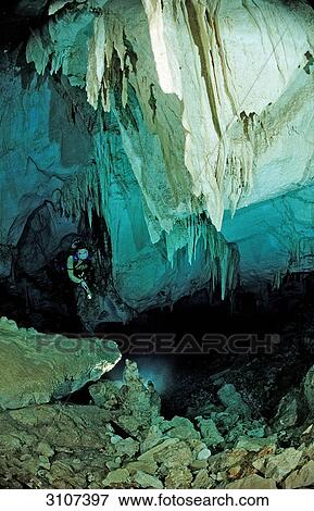 Stock Photo - Scuba diver in underwater cave Cueva Taina, Punta Cana, Dominican Republic . Fotosearch