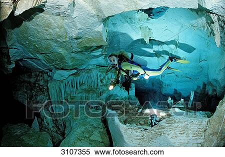 Scuba diver in underwater cave Cueva Taina, Punta Cana, Dominican Republic View Large Photo Image Stock Photography - Scuba diver in underwater cave Cueva Taina, Punta Cana, Dominican Republic . Fotosearch