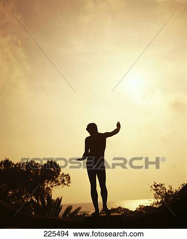 Silhouette of Apollon statue at dusk, Ischia Island, Italy View Large Photo Image Picture - Silhouette of Apollon statue at dusk, Ischia Island, Italy . Fotosearch