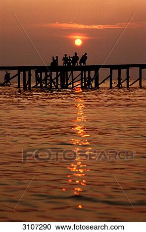 Sunset over jetty, Sipadan, Malaysia, silhouette View Large Photo Image Stock Image - Sunset over jetty, Sipadan, Malaysia, silhouette . Fotosearch