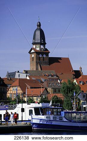 Tourists and boats at harbor, St. Marien Church, Lake Muritz, Mecklenburg Western Pomerania, Germany View Large Photo Image Stock Photo - Tourists and boats at harbor, St. Marien Church, Lake Muritz, Mecklenburg Western Pomerania, Germany . Fotosearch