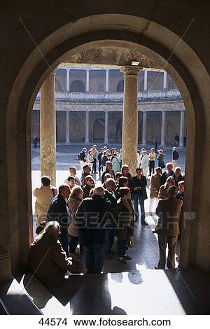 Picture - Tourists at archway of palace, Alhambra, Granada, Andalusia, Spain . Fotosearch