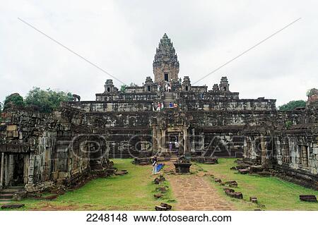 Tourists at old ruins of temple, Bayon Temple, Angkor Wat, Cambodia View Large Photo Image Stock Photo - Tourists at old ruins of temple, Bayon Temple, Angkor Wat, Cambodia . Fotosearch