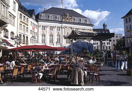 Stock Image - Tourists at outdoor cafe, Bonn, Germany . Fotosearch