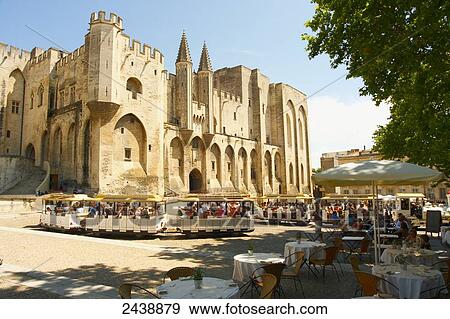 Stock Photo - Tourists at pavement cafe, Palais Des Papes, Avignon, Vaucluse, Provence-Alpes-Cote d'Azur, France . Fotosearch