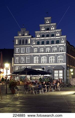 Tourists at sidewalk cafe, Luneburg, Lower Saxony, Germany View Large Photo Image Stock Photography - Tourists at sidewalk cafe, Luneburg, Lower Saxony, Germany . Fotosearch