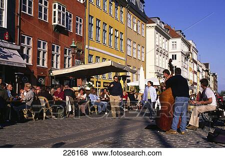 Tourists at sidewalk cafe, Nyhavn, Copenhagen, Denmark View Large Photo Image Stock Photo - Tourists at sidewalk cafe, Nyhavn, Copenhagen, Denmark . Fotosearch