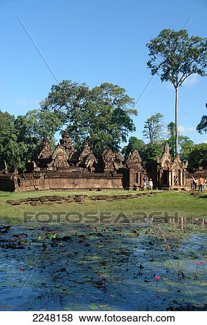 Tourists in front of old ruins of temple, Banteay Srei, Cambodia View Large Photo Image Stock Photo - Tourists in front of old ruins of temple, Banteay Srei, Cambodia . Fotosearch